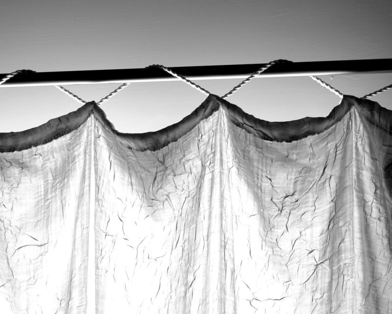 how to keep curtains from sliding on the rod