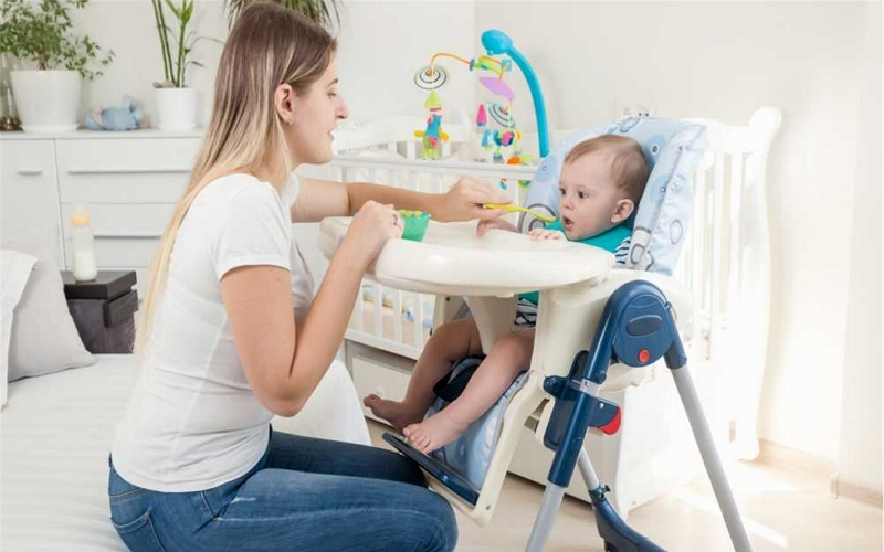 When can baby sit in highchair
